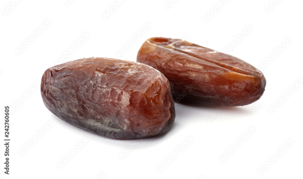 Sweet dates on white background. Dried fruit as healthy snack Sweet dates on white background. Dried fruit as healthy snack