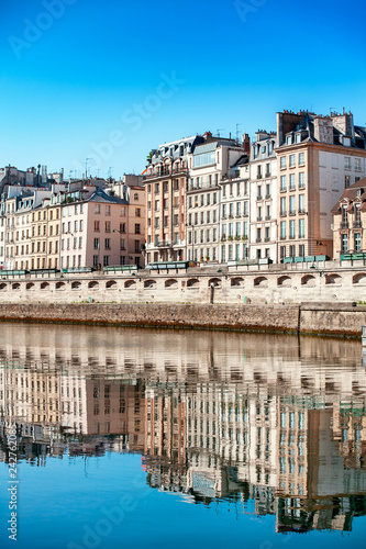 Reflection of Parisian buildings in the water of the Seine