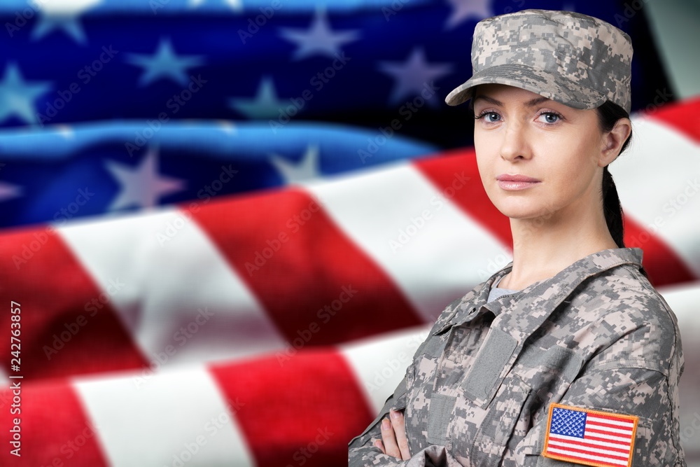 Portrait of female US army soldier on flag background Portrait of female US army soldier on flag background