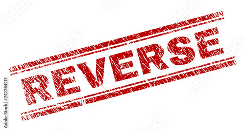 REVERSE seal watermark with distress texture. Red vector rubber print of REVERSE tag with dust texture. Text tag is placed between double parallel lines.