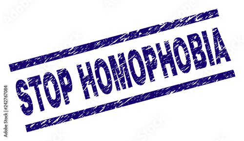 STOP HOMOPHOBIA seal watermark with distress style. Blue vector rubber print of STOP HOMOPHOBIA text with unclean texture. Text tag is placed between parallel lines.