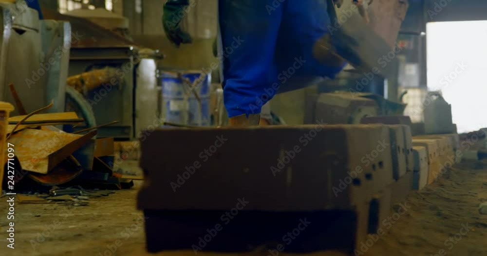 Workers working in foundry workshop Workers working in foundry workshop