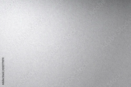 Light shining on rough stainless steel wall texture, abstract background