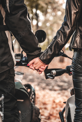 Hands of couple bikers. Happy Valentine's Day. 