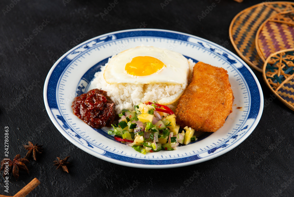 asian style fried fish fillet rice with sambal and salsa acar