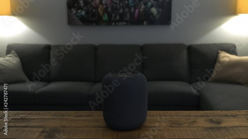 Apple HomePod smart speaker is instructed to turn on living room lights and then turn them off photo