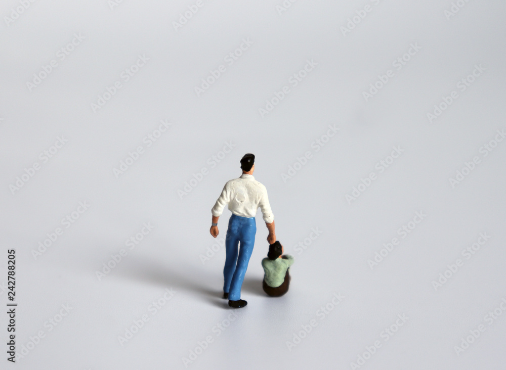 The concept of domestic violence. Miniature men and miniature women. The concept of domestic violence. Miniature men and miniature women.