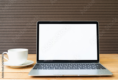 Coffee cup with laptop mockup on wood