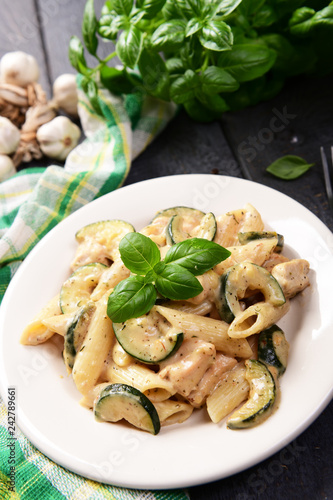 Penne pasta witch chicken and zucchini in cheese sauce