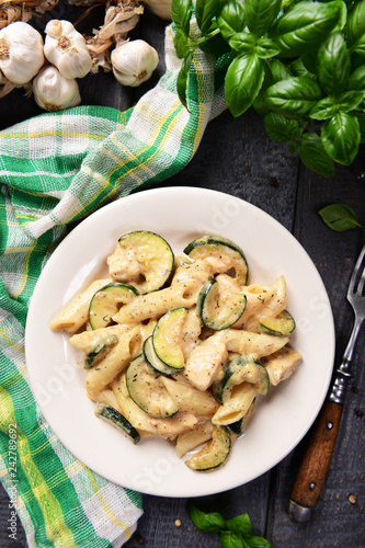 Penne pasta witch chicken and zucchini in cheese sauce