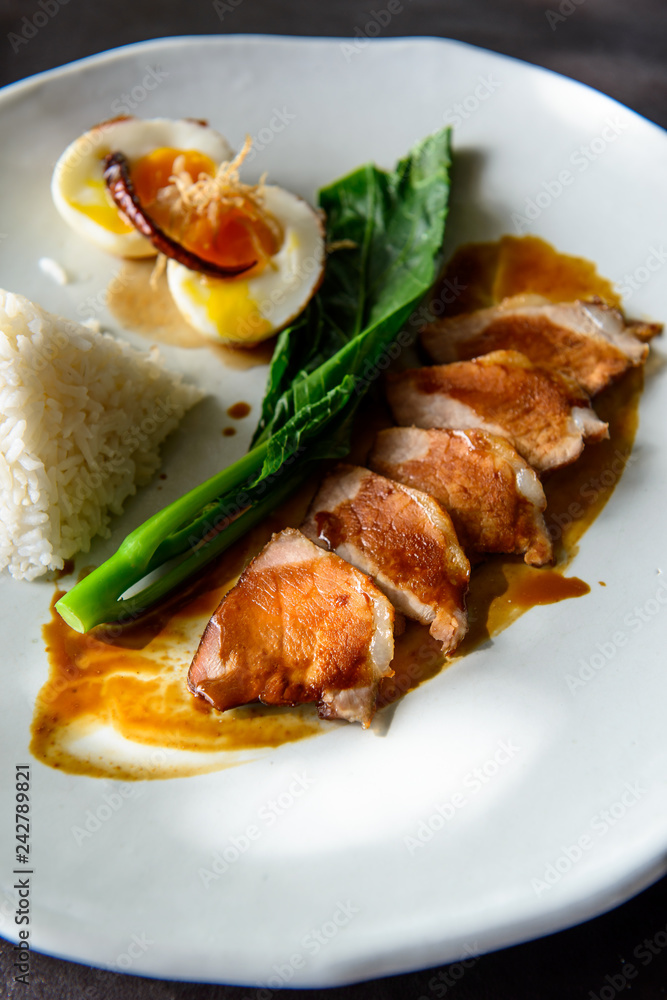 Grilled pork, boiled egg with steamed jasmine rice Grilled pork, boiled egg with steamed jasmine rice