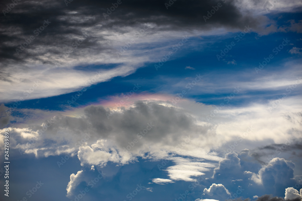 Naklejka premium rainbow clouds with blue sky background texture