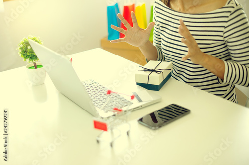 woman sit at computer table look at the product