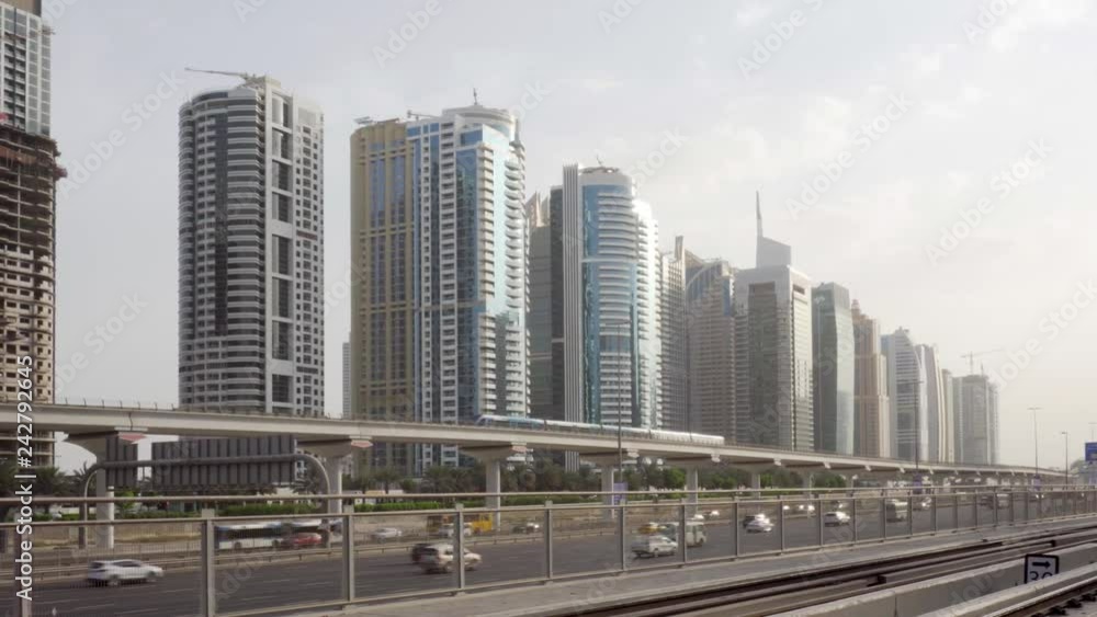 Train of the Dubai Metro passing above Sheikh Zayed Road Train of the Dubai Metro passing above Sheikh Zayed Road
