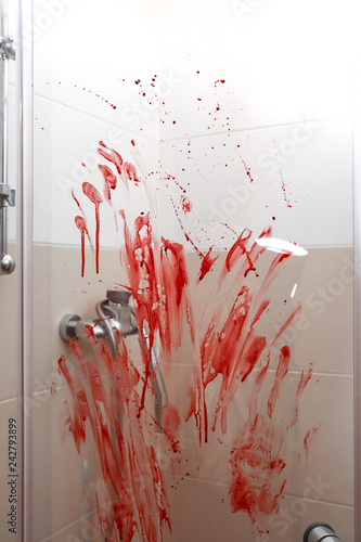 Blood streaks on glass door...