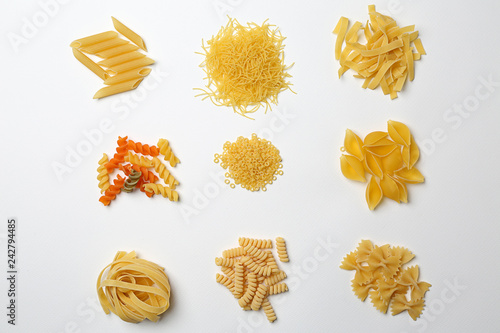 Assortment of uncooked pasta on white background