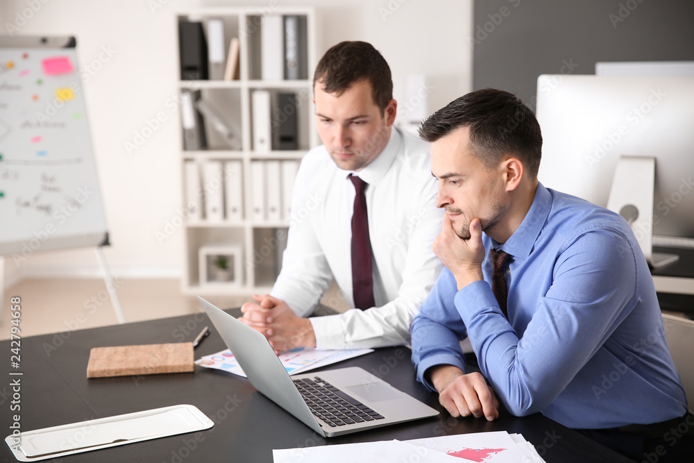 Young colleagues working together in modern office Young colleagues working together in modern office