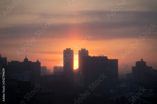 dawn in the city in smog