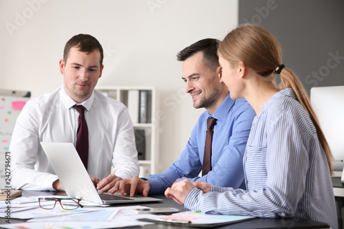 Young colleagues working to...