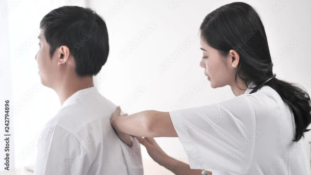 Asian doctor with breathing and back examination for her patient, work concept. Asian doctor with breathing and back examination for her patient, work concept.
