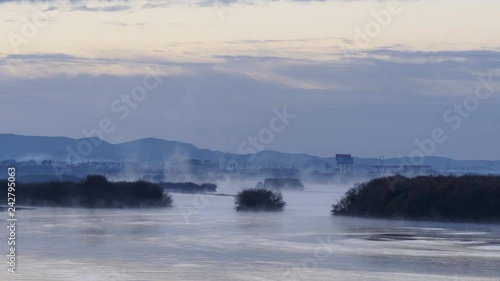Morning mist over water river. Fog river in early morning. Landscape fog over morning lake. Panoramic view from pier misty fog on river in early morning. Foggy river. 4K version.