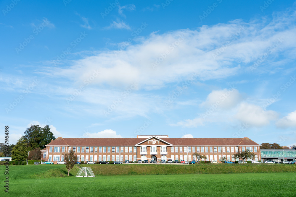 Obraz premium The entrance of the Vardean School with school lawn in front of the school in Brighton, East Sussex UK.