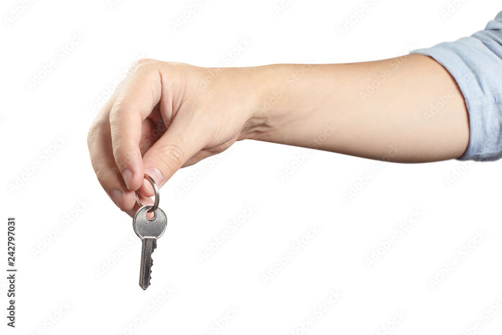 Hand holding a key, isolated on white background Hand holding a key, isolated on white background
