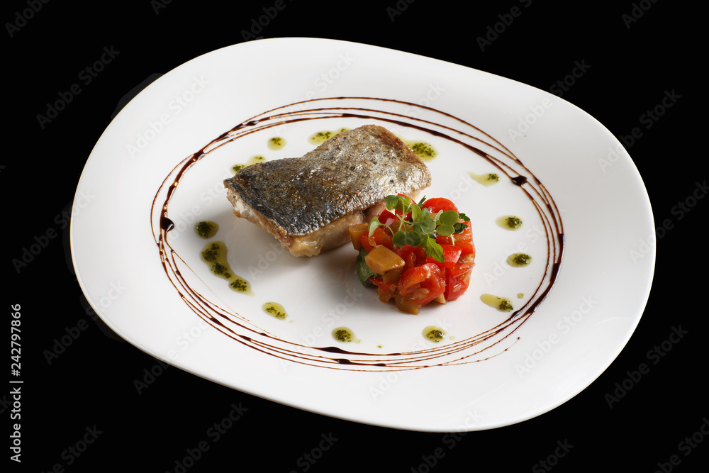 Dish of fish fillet with lettuce and lemon on plate Dish of fish fillet with lettuce and lemon on plate