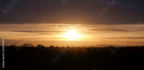 the sun rising over the Sussex countryside, Barcombe, Sussex, UK
