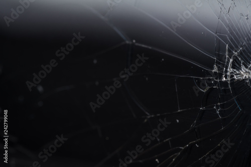 Broken smartphone screen, cracks and shattered glass under various eels