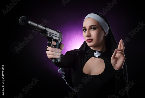 a nun with a weapon in the name of faith