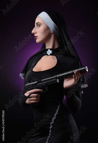 a nun with a weapon in the name of faith
