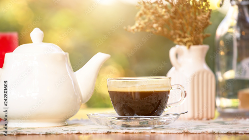 Fototapeta premium hot cup of black coffee on table