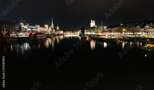 Zurich, ZH / Switzerland - January 4, 2019: night time city skyline view of Zurich with the river Limmat © makasana photo