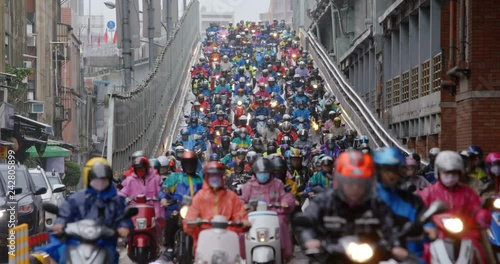 Crowded of scooter in taipei city at rain day photo