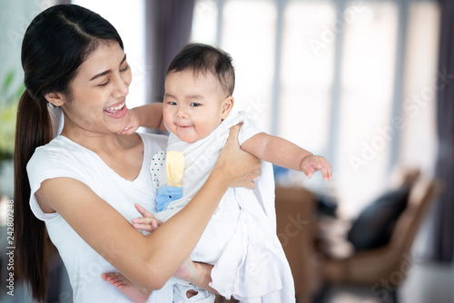 Asian mother and her baby play togather