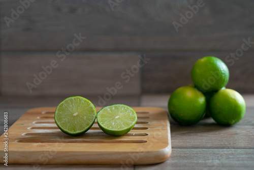 Cut limes on wooden tray
