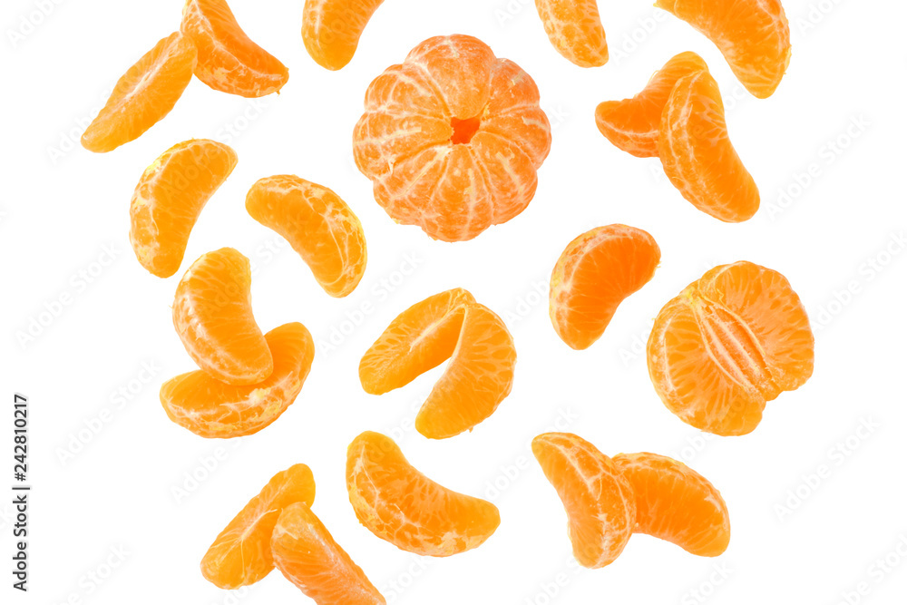 Fotografie mandarin with flying slices isolated on white background