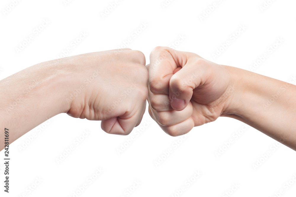 Two fists hitting each other, isolated on white background Two fists hitting each other, isolated on white background