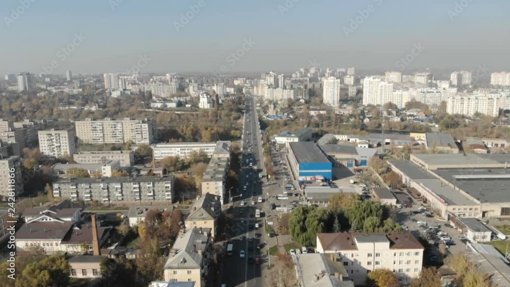 Aerial view of road junction with moving cars and railway tracks on which the train rides. The concept of the urban form. Aerial view of road junction with moving cars and railway tracks on which the train rides. The concept of the urban form.