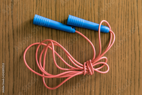 red and blue tied jumping rope isolated f