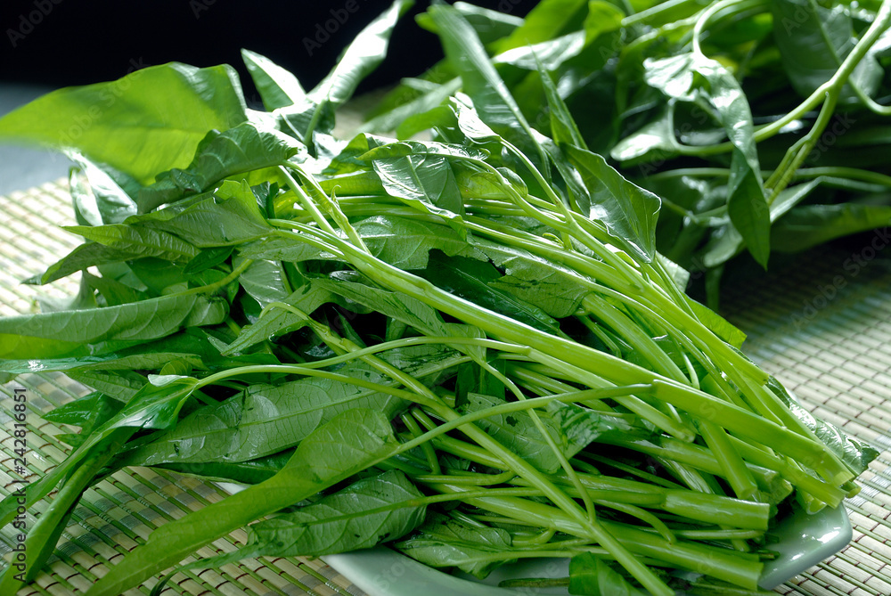 Fototapeta premium Fresh green water spinach on the mat