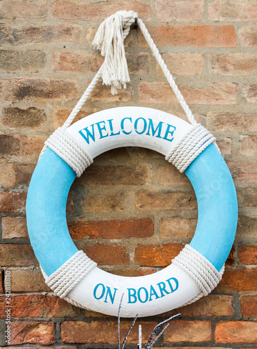 Safety Lifebouy hook on Tilewall - Image. Lifebuoy on stone background with blank space for text. Top view travel or vacation concept. Summer background. Flat lay photo, top view