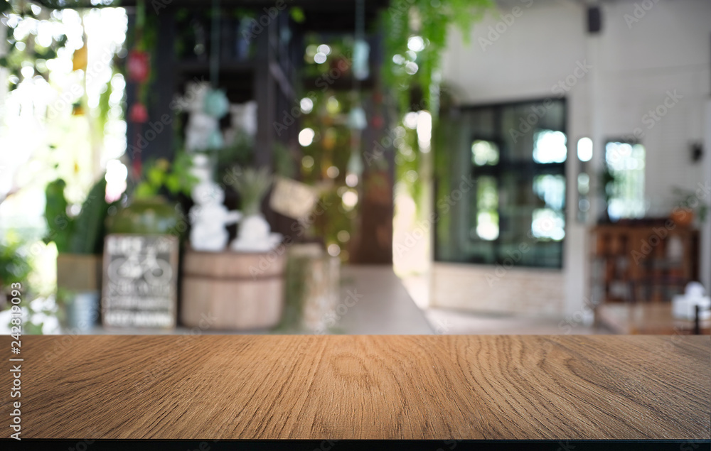 Empty dark wooden table in front of abstract blurred bokeh background of restaurant . can be used for display or montage your products.Mock up for space. Empty dark wooden table in front of abstract blurred bokeh background of restaurant . can be used for display or montage your products.Mock up for space.