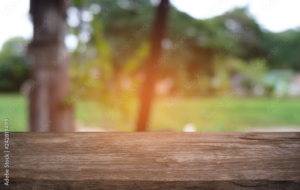 Empty dark wooden table in front of abstract blurred bokeh background of restaurant . can be used for display or montage your products.Mock up for space. Empty dark wooden table in front of abstract blurred bokeh background of restaurant . can be used for display or montage your products.Mock up for space.