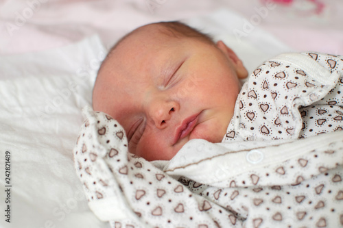 Sleeping newborn baby boy. Little newborn boy. Close-up portrait of a beautiful sleeping baby.