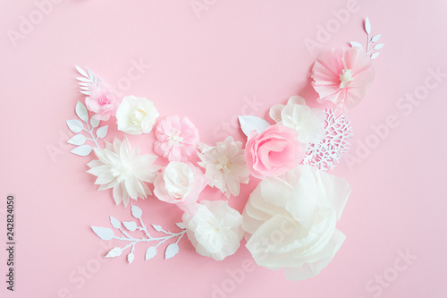 white and pink paper flowers on the pink background