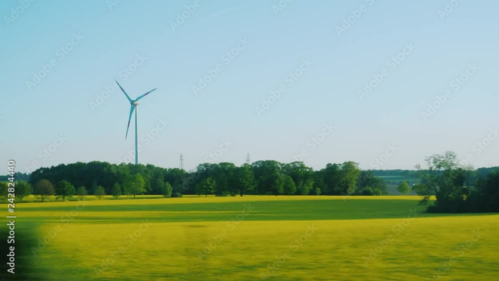Go by car in the agricultural region of Poland - you can see rapeseed fields and wind generators Go by car in the agricultural region of Poland - you can see rapeseed fields and wind generators
