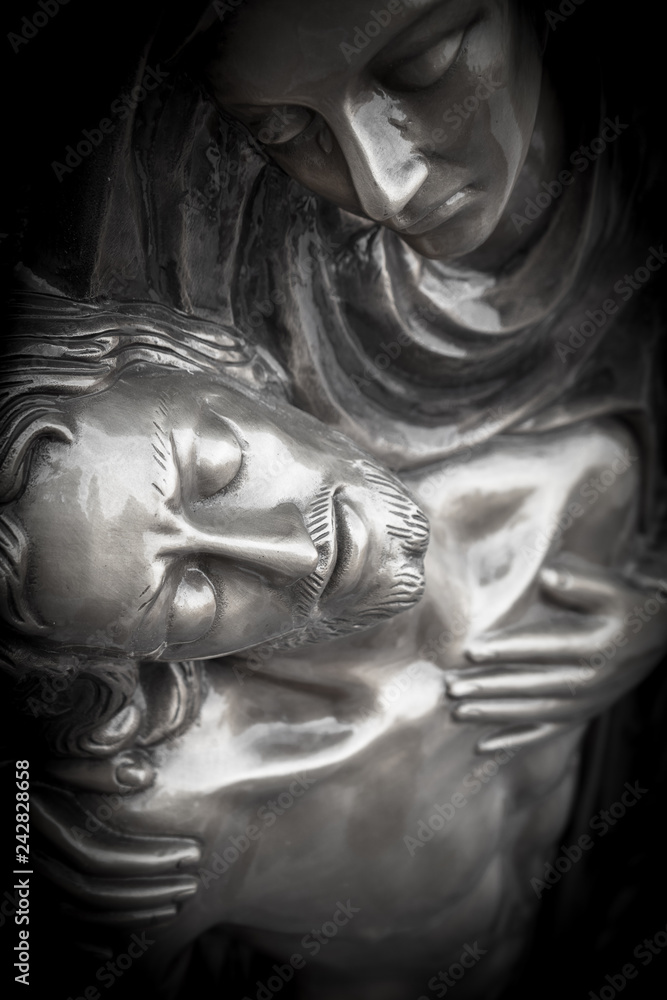 Statue of dead Jesus Christ being embraced by the Virgin Mary