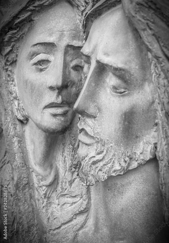 Statue pieta Virgin Mary holding Jesus
